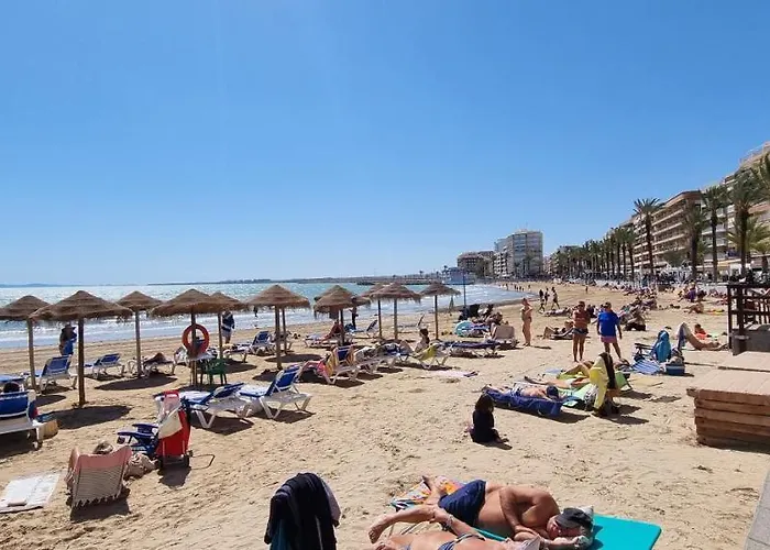 Апартаменты Dos Playas Торевьиа